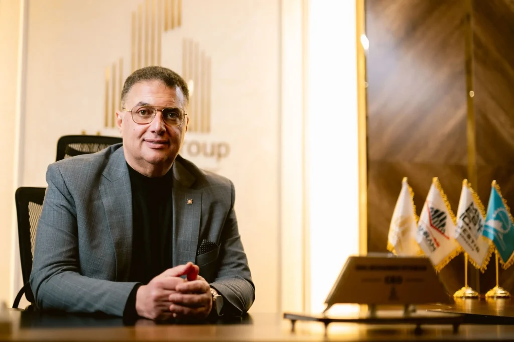 The CEO of Majestic Developments, a visionary leader in real estate development, sitting at his desk in Egypt, representing a leading real estate company.